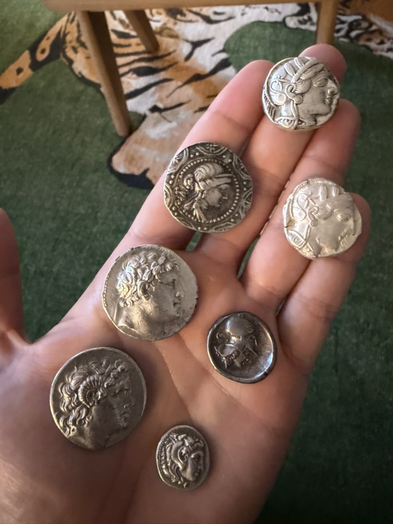 Coin obverse side details in hand